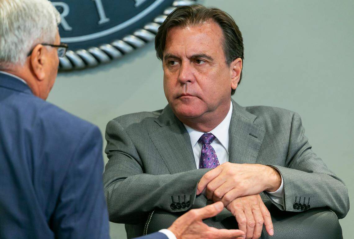 Commissioners Alex Diaz de la Portilla, right, and Manolo Reyes talk during a special meeting at Miami City Hall in Coconut Grove, Florida on Thursday, April 28, 2022. The meeting was held to discuss the Miami Freedom Park proposal.