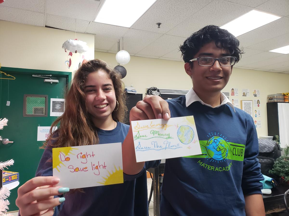 Swany Martinez and D’angelo Pinos, students at Mater Academy Charter High School, learn about the importance of saving energy through the Dream in Green program at their school.