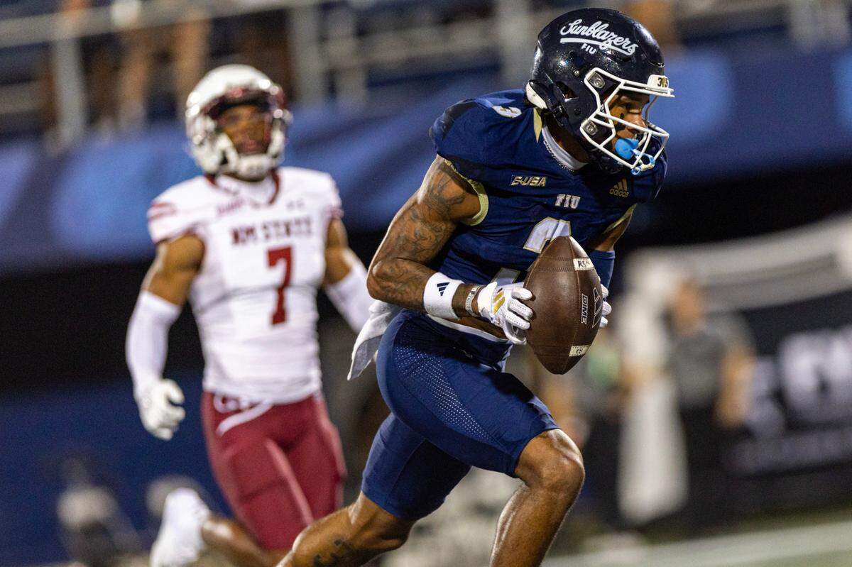 Florida International University Panthers wide receiver Eric Rivers (3) runs for a touch down after making the reception during the second half of an NCAA Conference USA football game against the New Mexico State Aggies at Pitbull Stadium on Tuesday, October 29, 2024, in Miami, Fla.