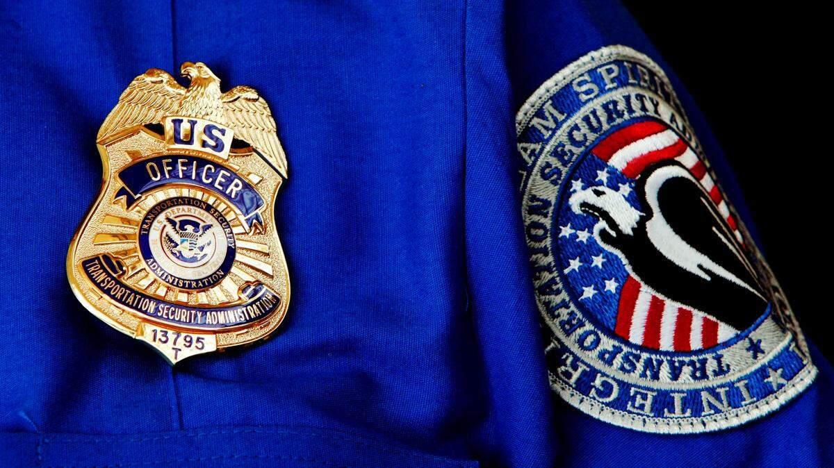 In this June 27, 2008, file photo, TSA Supervisor Jennifer Haslip poses at Washington D.C.’s Ronald Reagan National Airport. A different TSA officer stole thousands in unemployment benefits while working at the Orlando airport, feds say.