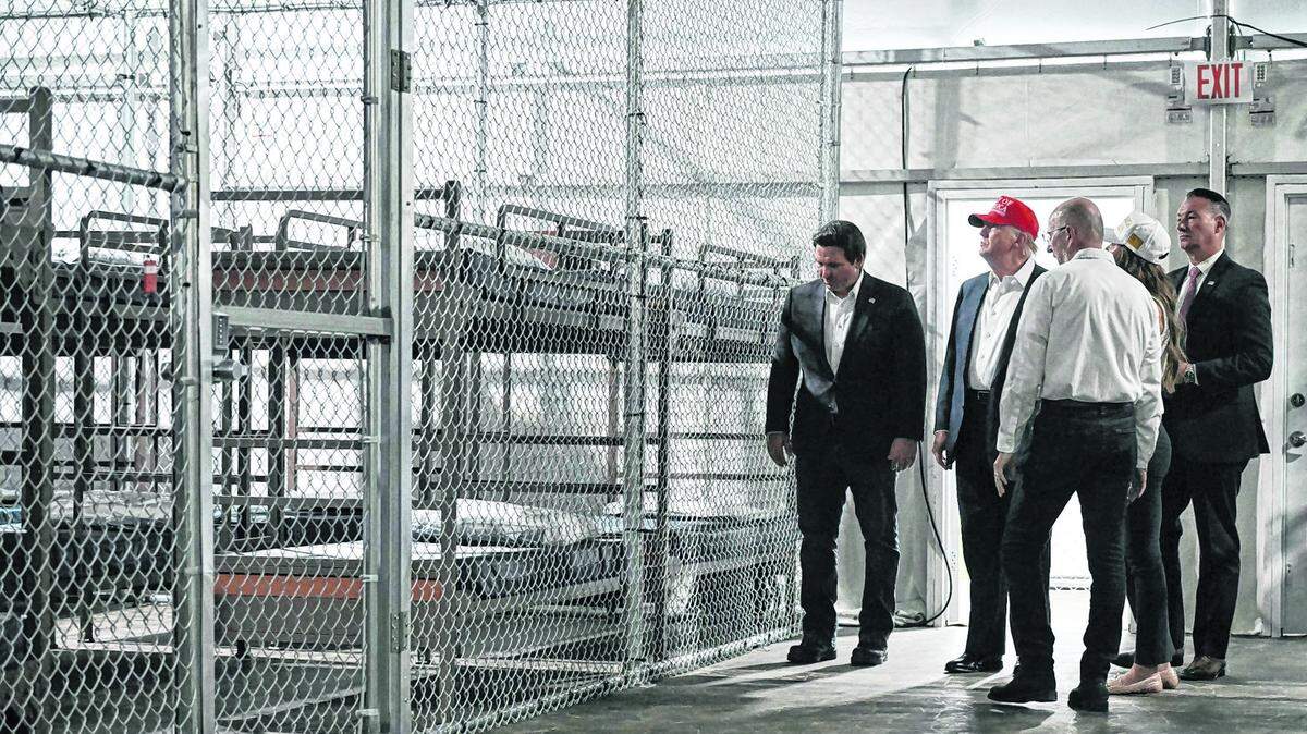 U.S. President Donald Trump and Florida Gov. Ron DeSantis tour the Alligator Alcatraz immigration detention center on July 1, 2025.