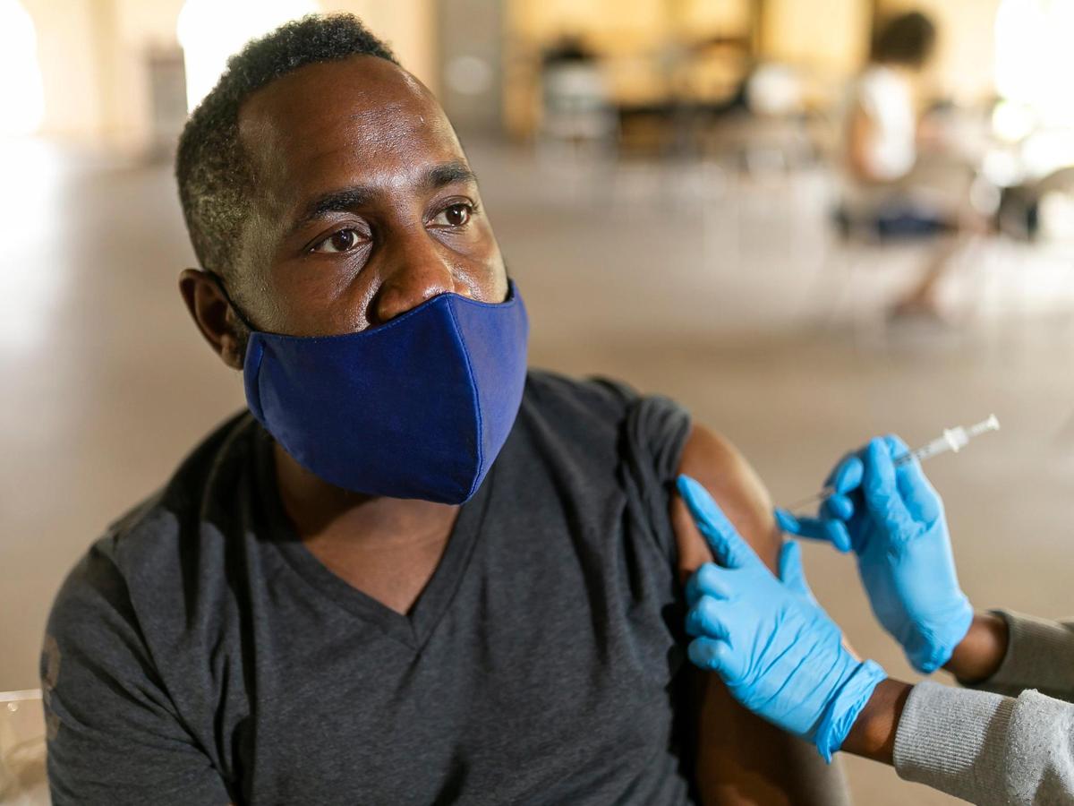 Greg Small receives his first shot of the Pfizer-BioNTech COVID-19 vaccine at C.B. Smith Park in Pembroke Pines, Florida on Friday, October 8, 2021.