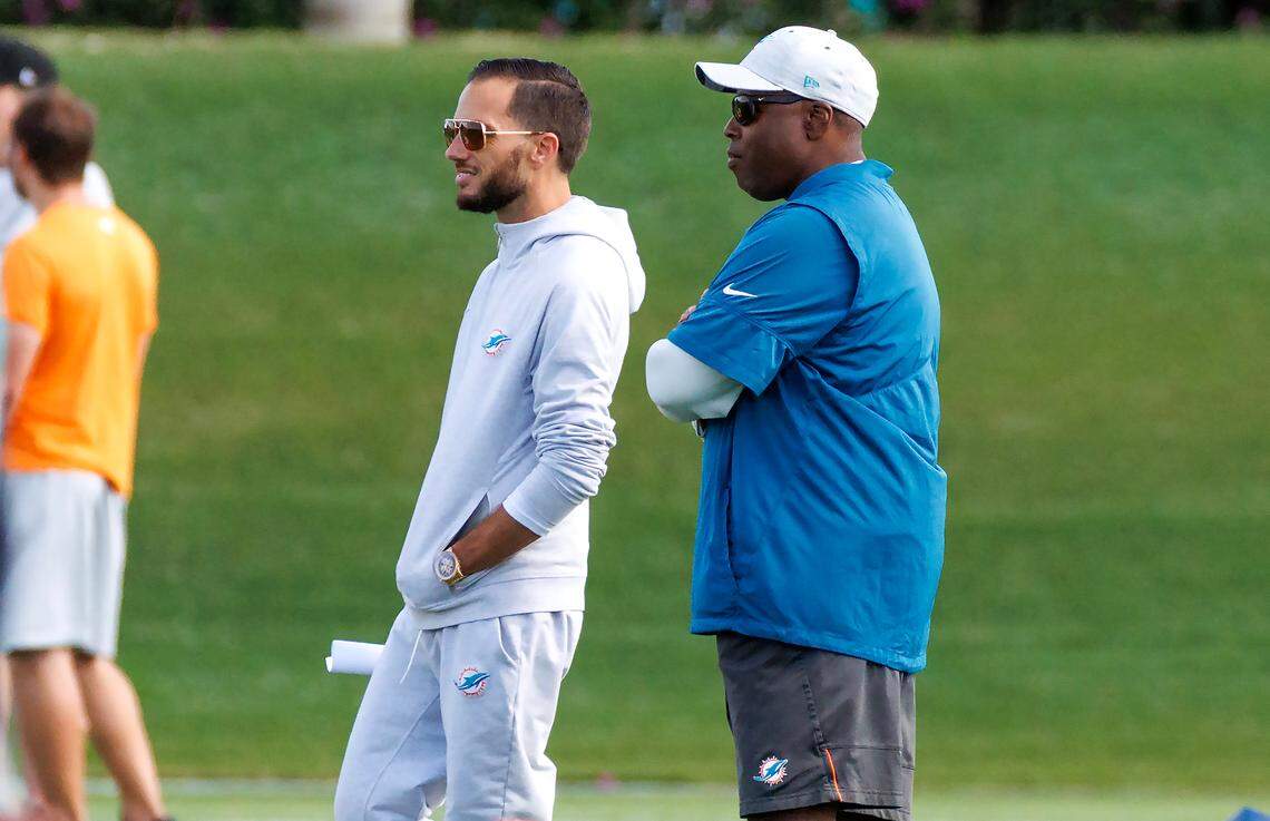Miami Dolphins head coach Mike McDaniel and Dolphins general manager Chris Grier look the practice at Baptist Health Training Complex in Hard Rock Stadium on Wednesday, December 28, 2022 in Miami Gardens, Florida.