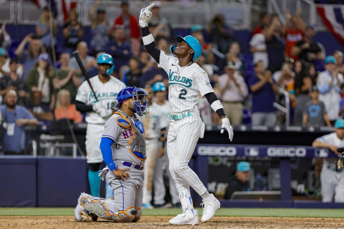 Miami Marlins center fielder Jazz Chisholm Jr. (2) reacts at home plate after hitting a home run during the eighth inning against the New York Mets at loanDepot park on Friday, March 31, 2023.