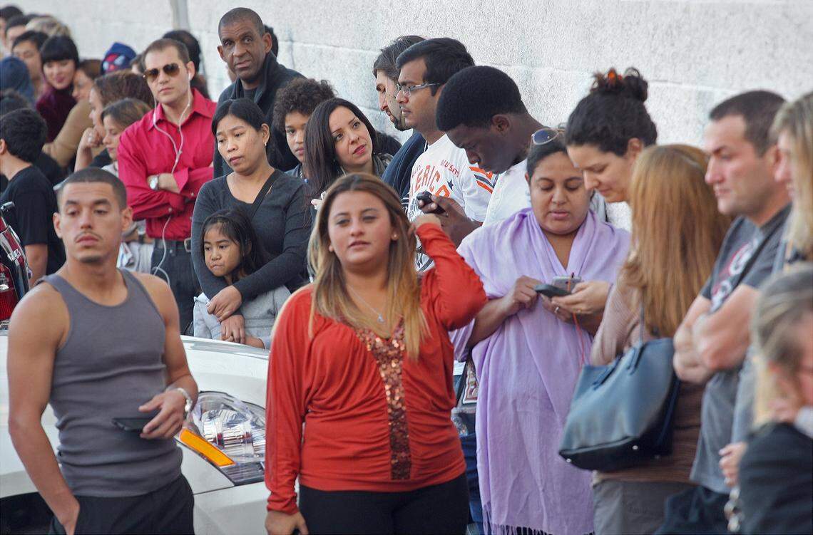 In this file photo from Nov. 29, 2013, Toy R Us shoppers lined up outside the Kendall store at 8789 SW 117th Ave. waiting for the doors to open to start holiday shopping. That Toy R Us is long gone. A Tesla showroom and service center is opening in this space in late 2026. Soon you will see electric cars and charging stations and car shoppers where once toys thrived.