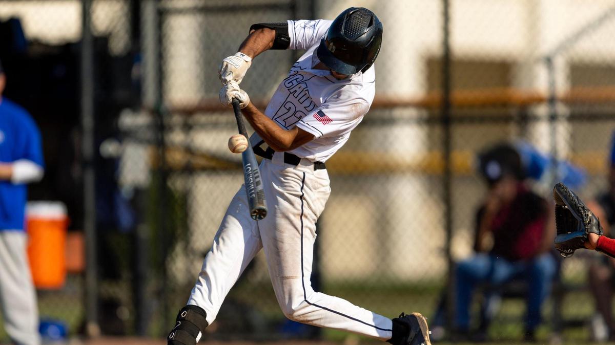 West Broward batter Jason Wachs (22) hits the ball for an inside the park grand slam to tie the game 5-5 during a high school baseball regional semi-final game against South Dade at Bobcat Field in Pembroke Pines, Florida, on Wednesday, May 10, 2023.