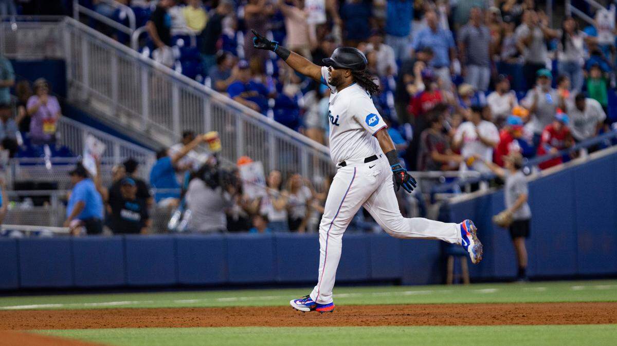 Miami Marlins first baseman Josh Bell (9) points to the crowd after hitting a home run during the third inning of a baseball game on Sunday, Sept. 24, 2023, at loanDepot Park in Miami.
