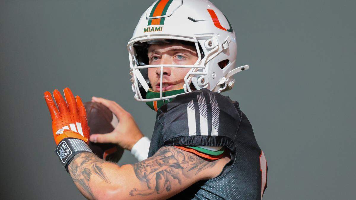 Miami Hurricanes quarterback Carson Beck (11) throws the football during football practice at the Carol Soffer Indoor Practice Facility at the University of Miami in Coral Gables, Florida, on Thursday, Aug. 7, 2025.