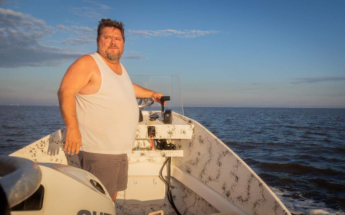 Joseph Cannon, a clam farmer in Cedar Key, drives his boat out to a clam harvesting site on Oct. 2. that was devastated after Hurricane Helene.