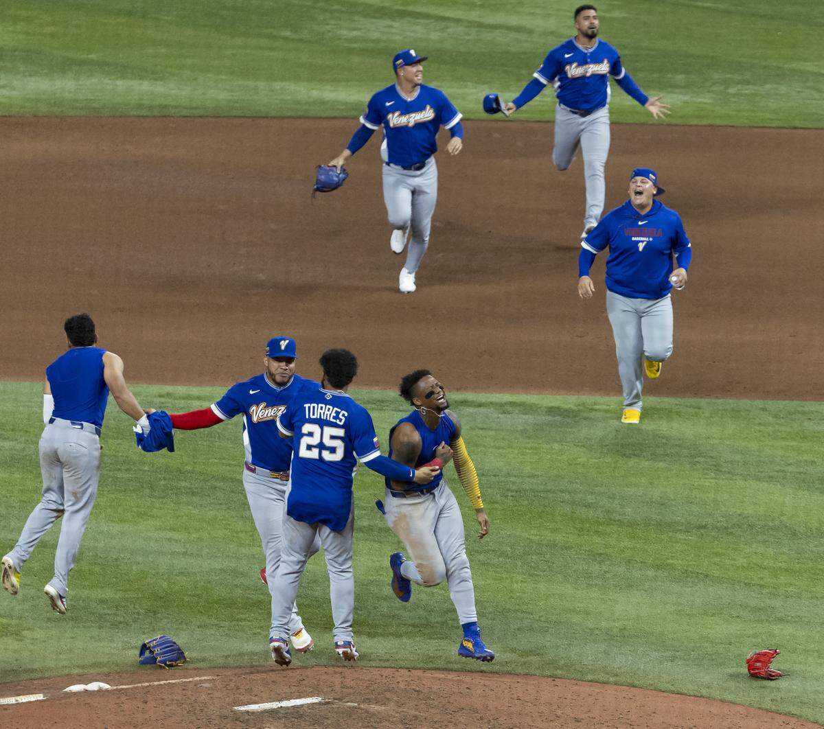Venezuela players celebrate after they defeated the United States in their World Baseball Classic final game at loanDepot Park on Tuesday, March 17, 2026, in Miami, Fla.