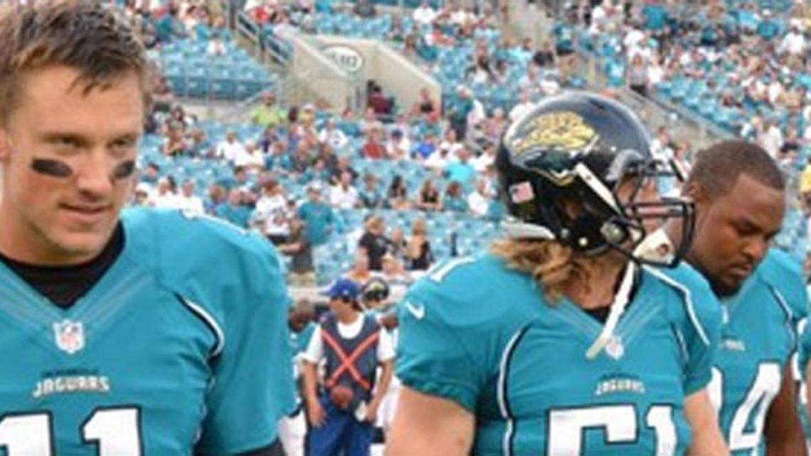 Monty Grow, left, during his playing days with the Jacksonville Jaguars. The former Florida Gator was sentenced to 22 years in prison on Monday in a healthcare fraud case in Miami.