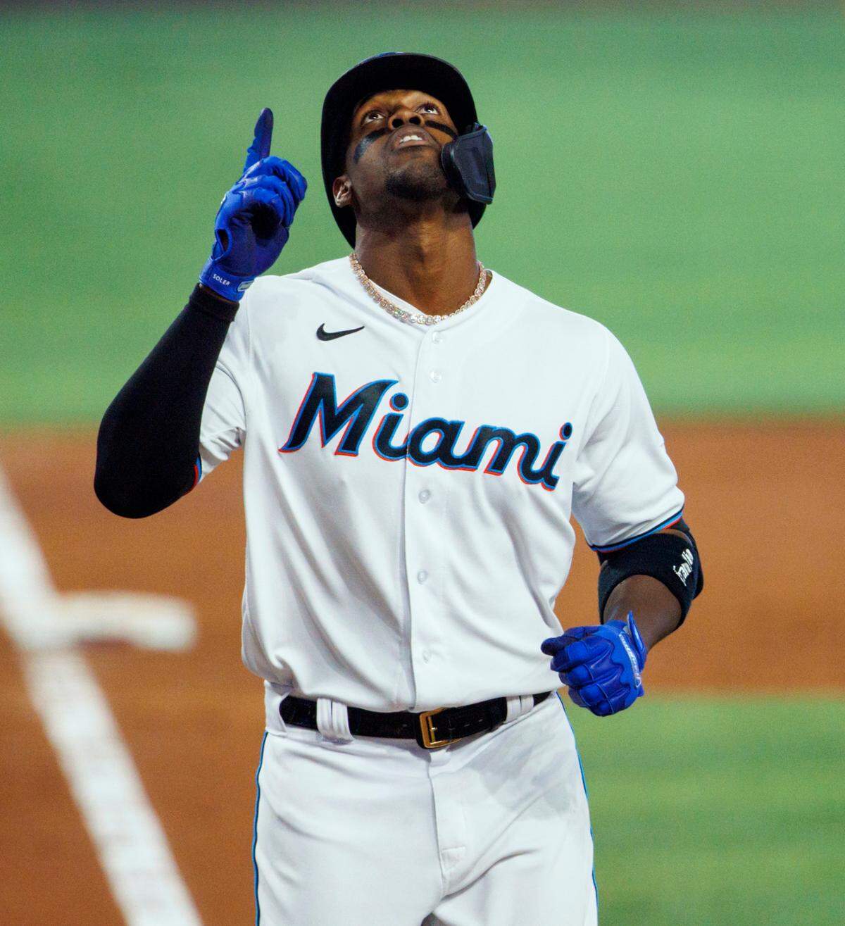 Miami Marlins left fielder Jorge Soler (12) reacts after hitting a solo home run during the third inning of a baseball game against the Milwaukee Brewers at LoanDepot Park on Sunday, May 15, 2022 in Miami, Florida.