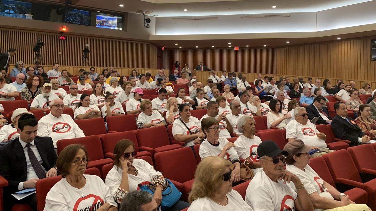 Residents of areas of unincorporated Miami-Dade County wear matching anti-annexation shirts to protest requests from the city of Coral Gables to absorb Little Gables and High Pines/Ponce Davis. A committee of the County Commission rejected the proposals Wednesday.