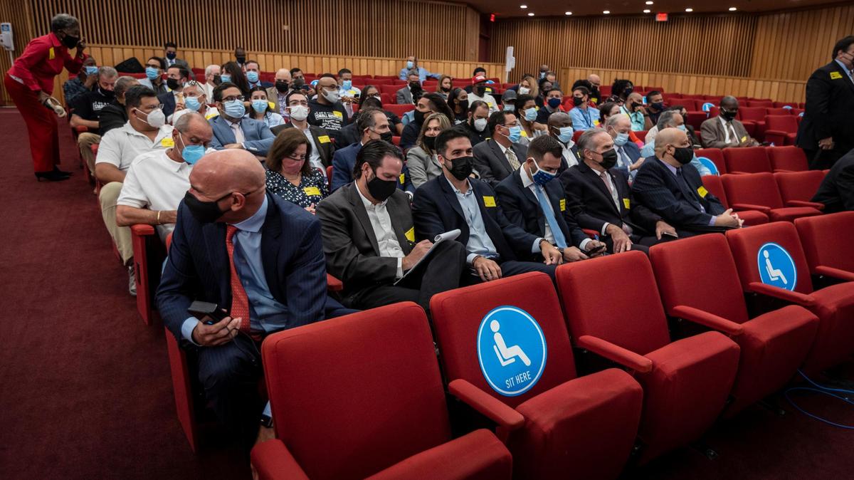 People wearing masks were allowed to sit in the Miami-Dade County commission chambers on Tuesday, May 4, 2021, for the first time since COVID-19 restrictions began last year.