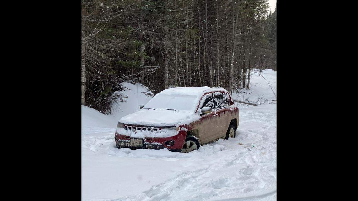The two women were trapped in their car after it got stuck and ran out of gas, Maine officials said.