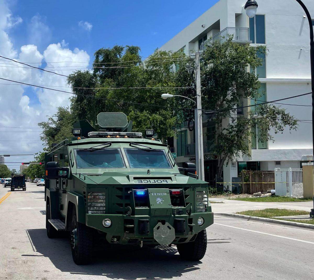 Police move into Coconut Grove during a search for shooting suspects in Coconut Grove.