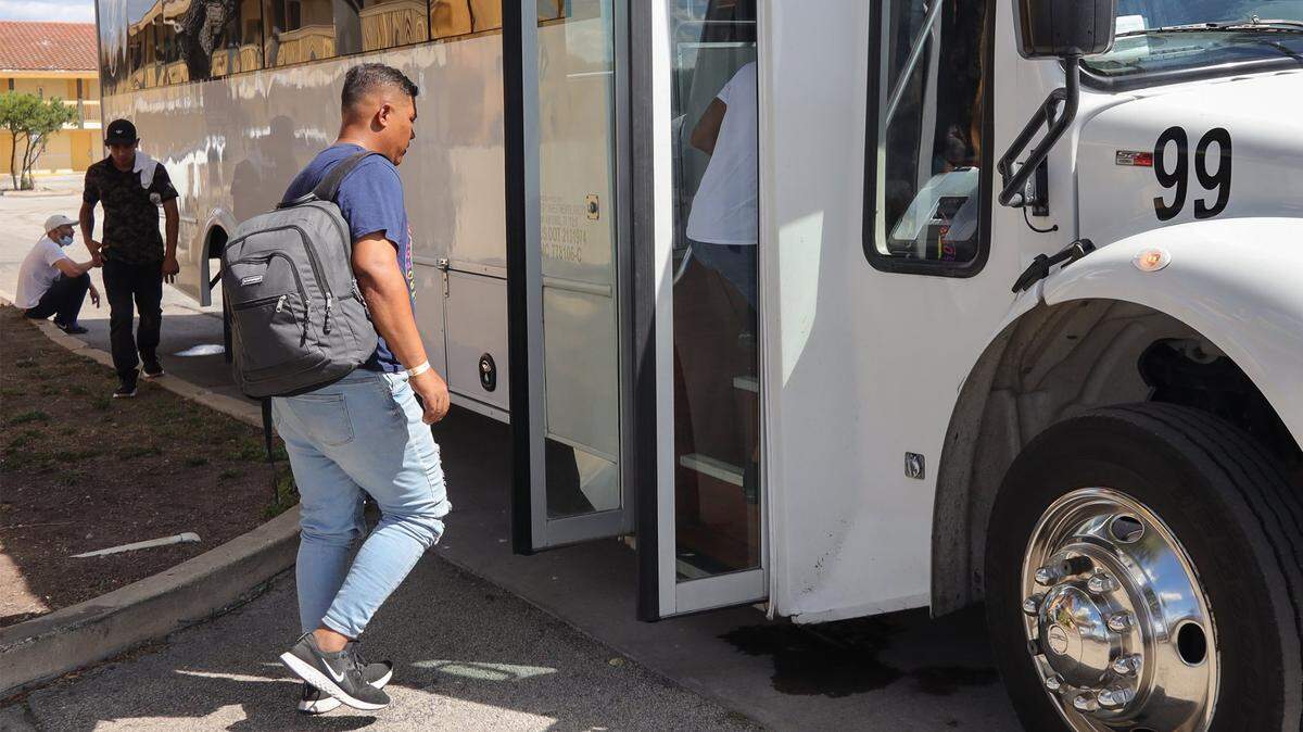 Conflicted Venezuelan migrant Dairon Banachera boards the bus departing for the Migrant Resource Center causing several of his friends to be left behind at the La Quinta hotel. About twenty migrants (mostly men) boarded a charter bus back to the Migrant Resources Center after their flight out of San Antonio, Texas was cancelled on Tuesday, September 20, 2022.
