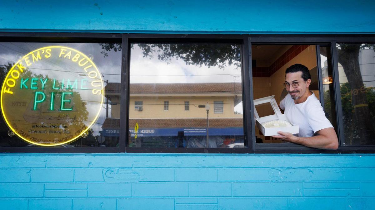 Joshua Abril, owner and operator of Fookem’s Fabulous, shows off one of his pies at his new Coconut Grove store.