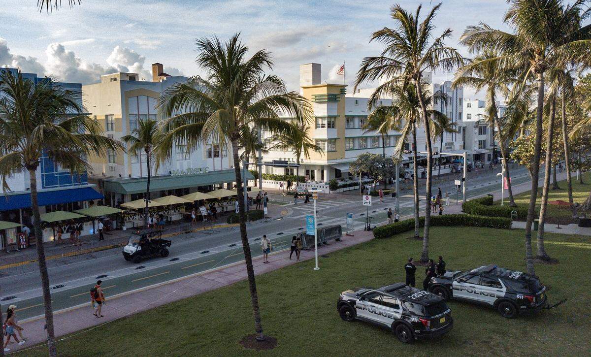 City of Miami Beach police officers stand watch along Ocean Drive late afternoon during spring break on Miami Beach, Florida on Friday, March 8, 2024.