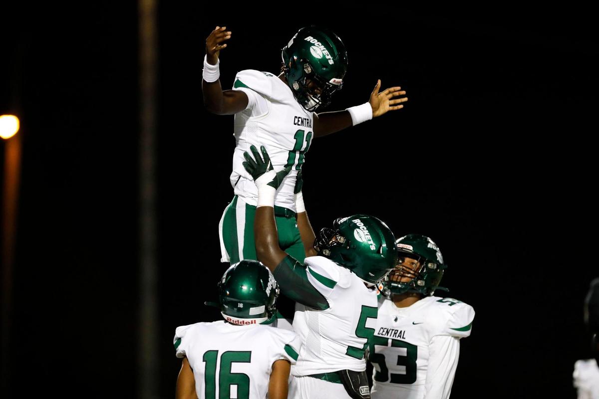 Central Rockets quarterback Jc Evans (11) celebrates with teammates after scoring a touchdown against the Norland Vikings during the first quarter of a high school football game at Traz Powell Stadium in Miami Florida, Friday, October 13, 2023.