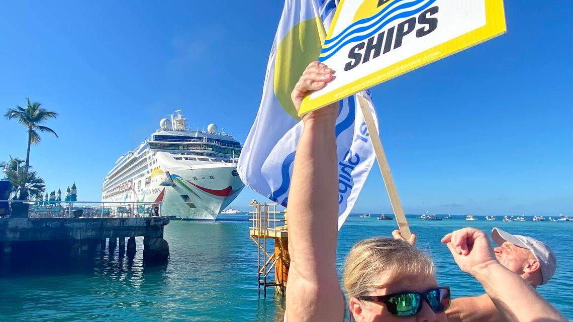 File photo of a woman protesting the arrival of a cruise ship in Key West on Dec. 9, 2021.