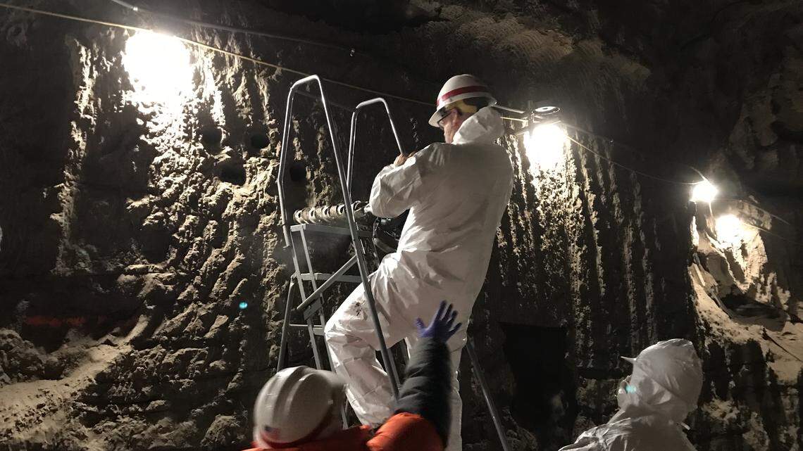 Tom Douglas of the Cold Regions Research and Engineering Laboratory drills into subsurface permafrost under Alaska to study microbe warming.
