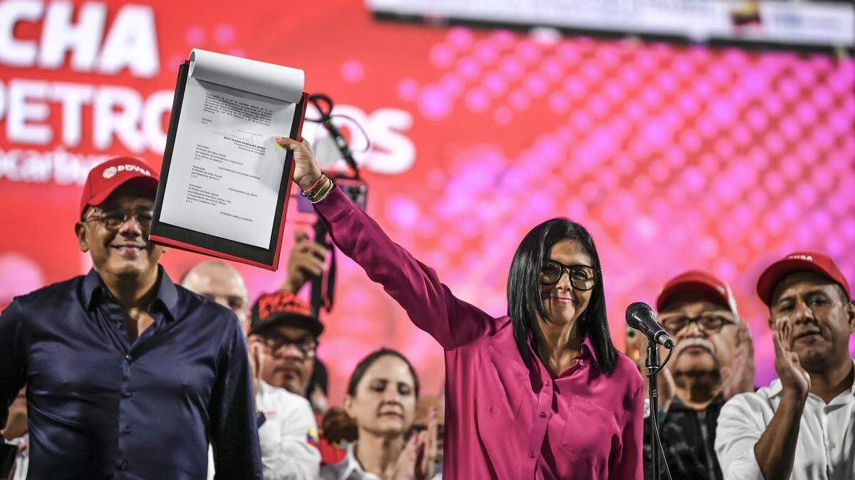 Delcy Rodriguez holds the new oil reform during an event at Miraflores Palace on January 29, 2026 in Caracas, Venezuela. 