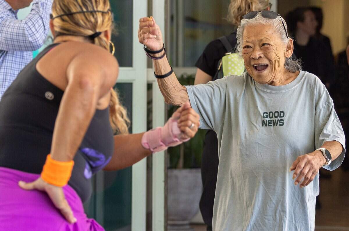 Joy Simm, right, a Hideaway Bay resident, dances with Paula Young, a line dance instructor, at Miami-Dade Homeless Trust's Hideaway Bay in Cutler Bay, Fla., on Tuesday, June 30, 2026.