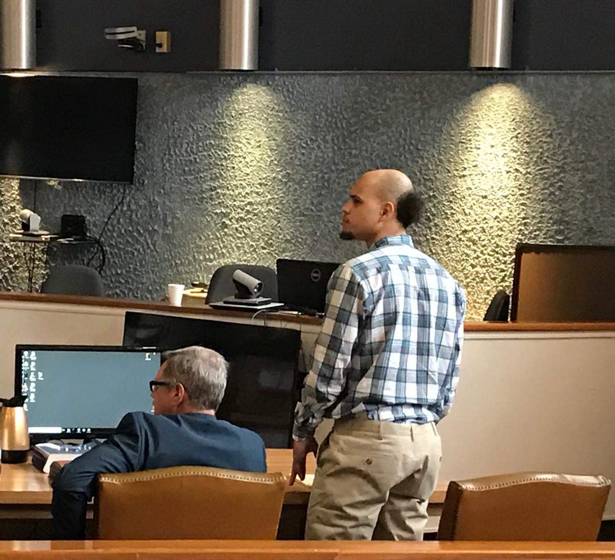 Timothy Thomas, standing, is with one of his attorneys, Jason Smith, at the Plantation Key courthouse Monday, April 23, 2018. Thomas is charged with first-degree attempted murder of a law enforcement officer stemming from an Oct. 24, 2015, gun battle with police, when he shot a Monroe County Sheriff’s Office deputy.