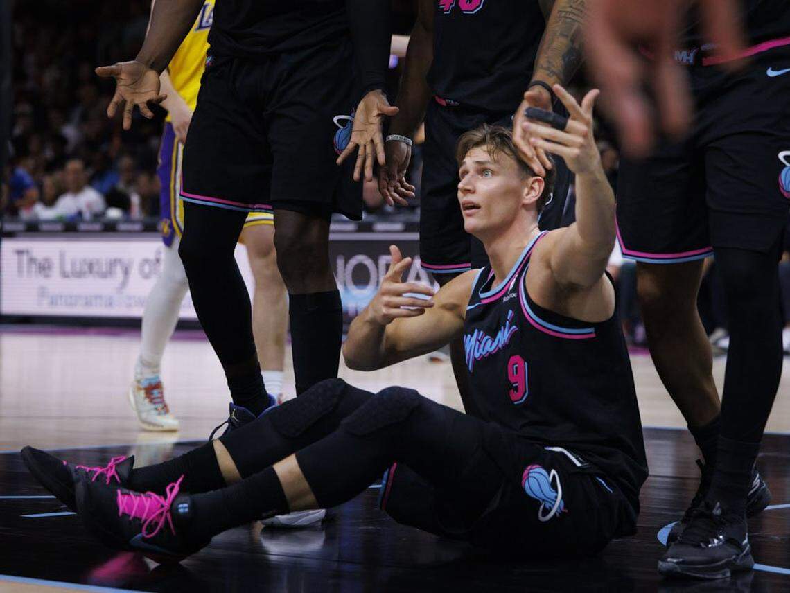Miami Heat guard Pelle Larsson (9) reacts to a call that was eventually overturned during the second half of a game against the Los Angeles Lakers on Thursday, March 19, 2026, at the Kaseya Center in downtown Miami, Fla. 