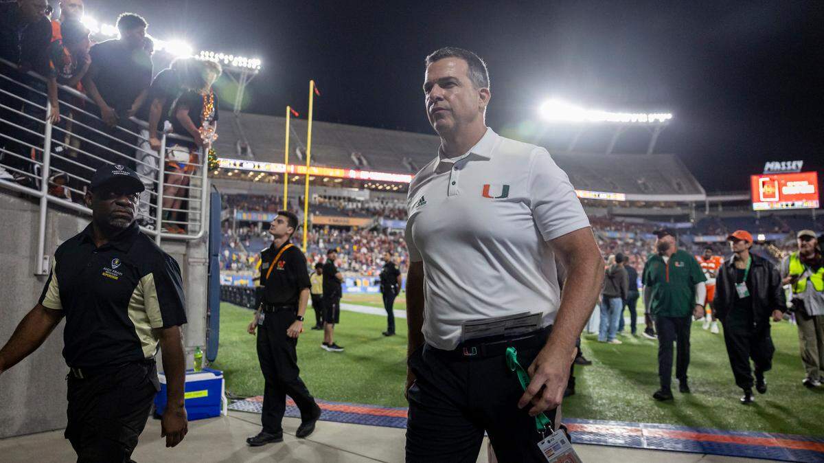 Miami Hurricanes head coach Mario Cristobal walks off the field after losing his Pop-Tarts Bowl football game against the Iowa State Cyclones at the Camping World Stadium on Saturday, Dec. 28, 2024, in Orlando, Fla.