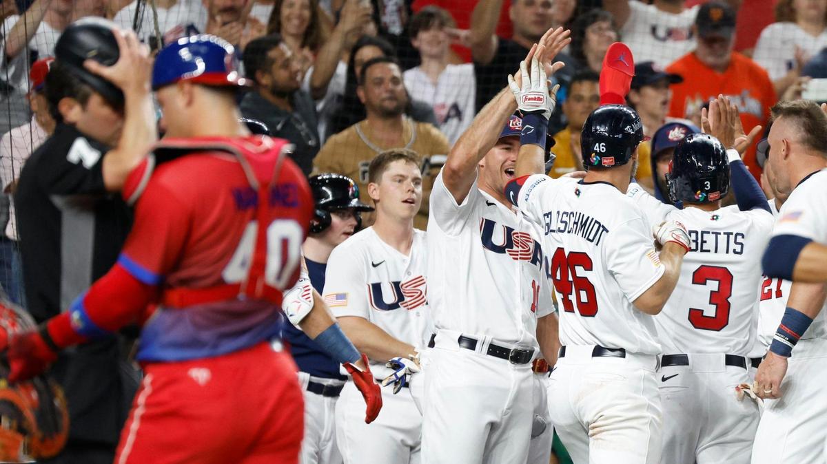 USA outfielder Mookie Betts (3) and USA infielder Paul Goldschmidt (46) celebrate after scoring in the first inning on Goldschmidt’s homer during the World Baseball Classic semifinal at loanDepot Park in Miami, Fla. on Sunday, March 19, 2023.