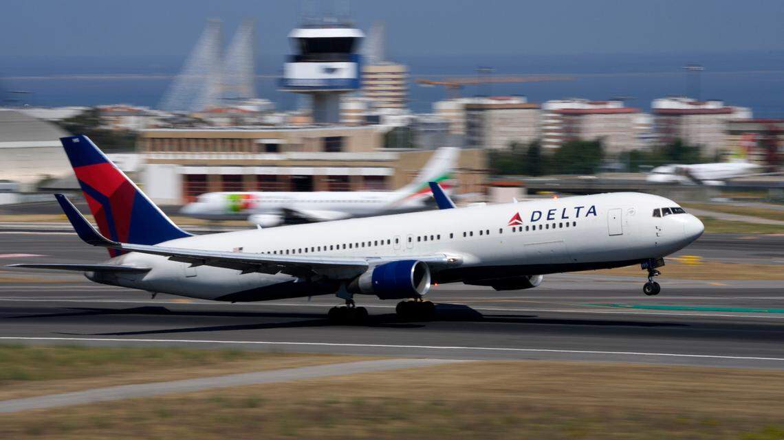 A former Delta Air Lines flight attendant is suing the company and says she was fired for a Facebook post showing former President Donald Trump with a KKK hood.