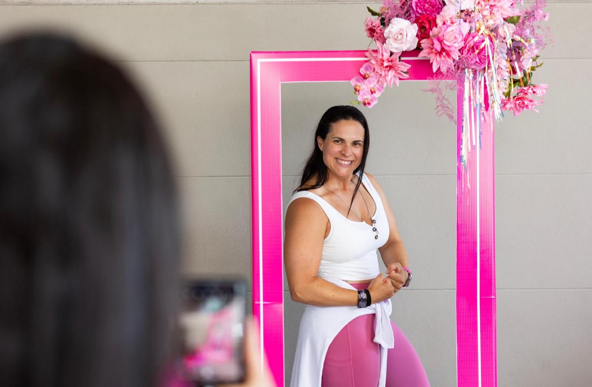 Melissa Rodriguez poses as workout Barbie before seeing the Barbie movie at Cinépolis Coconut Grove in Miami, Fla., on Sunday, July 23, 2023.