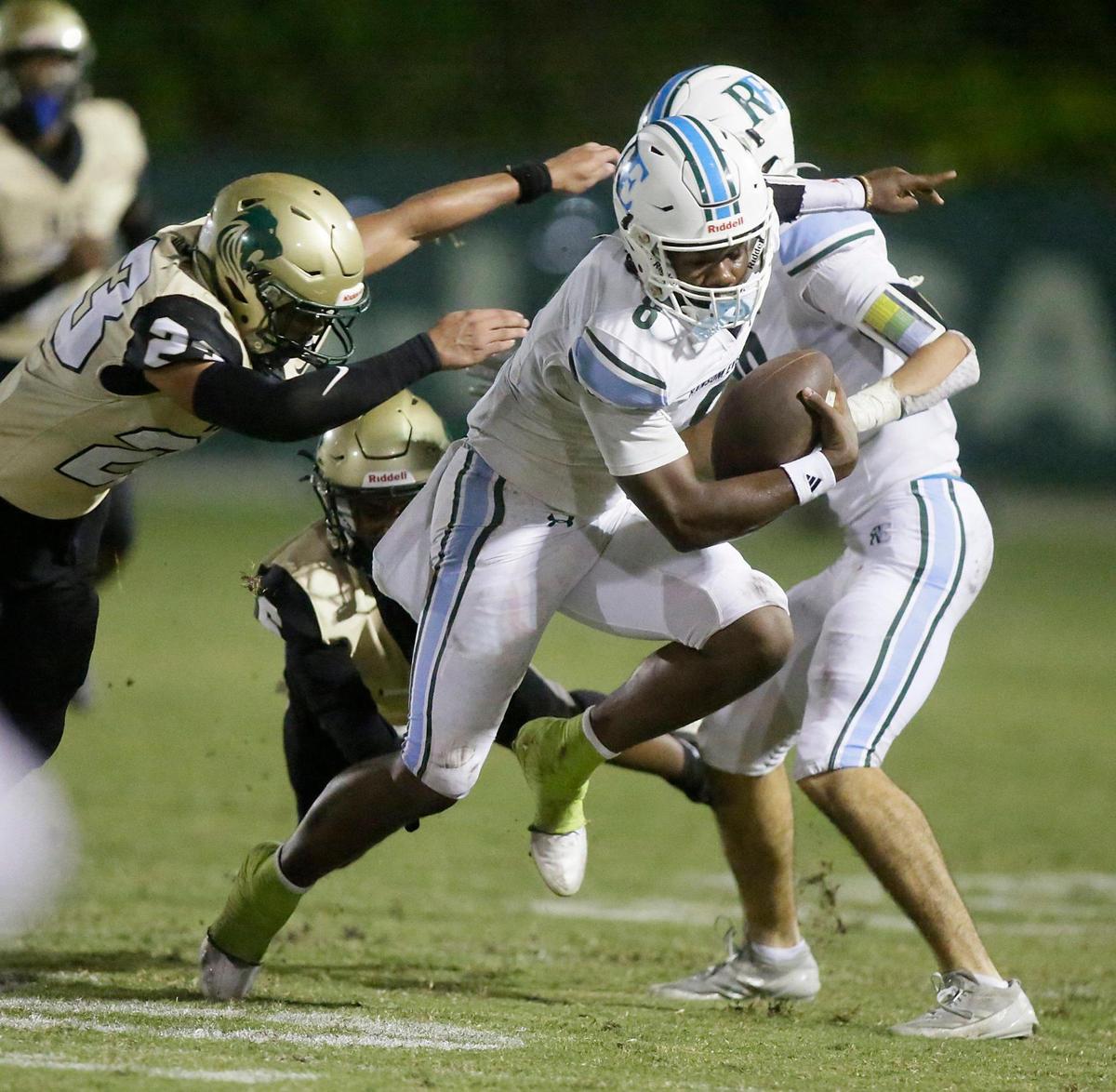Ransom Everglades Raiders quarterback Neimann Lawrence (8) tries to break free from Immaculata-La Salle Royal Lions defender during the football game on Thursday, November 7, 2024 at Immaculata-La Salle HS in Miami. Andrew Uloza / for Miami Herald