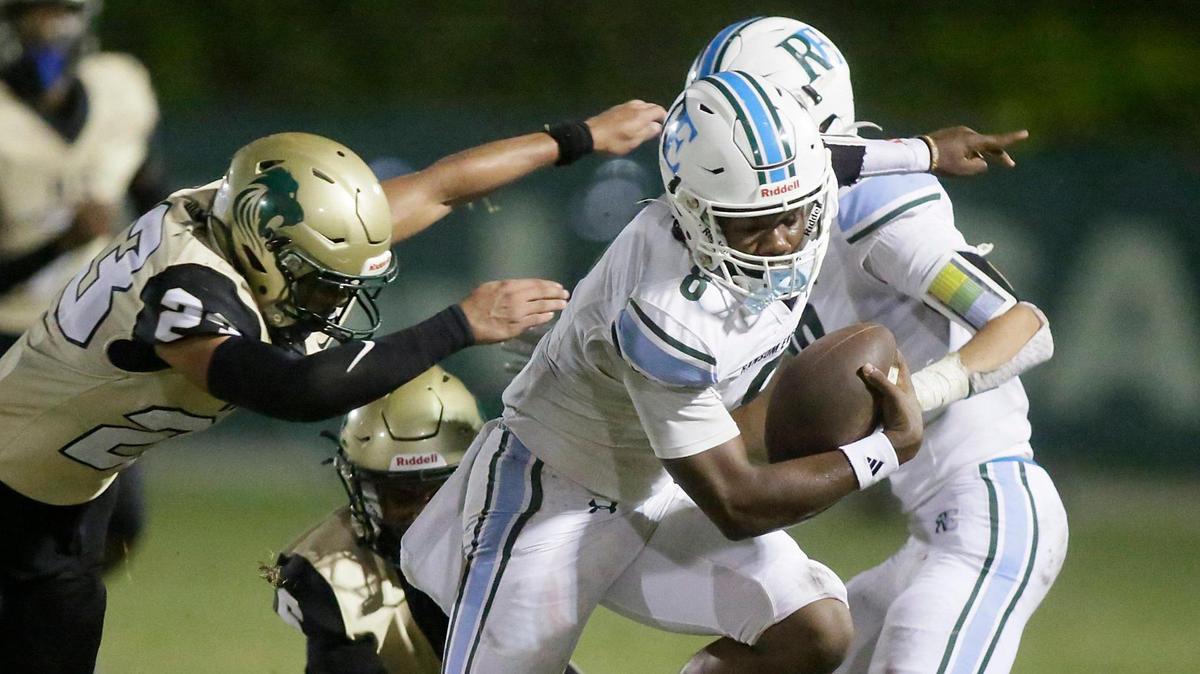 Ransom Everglades Raiders quarterback Neimann Lawrence (8) tries to break free from Immaculata-La Salle Royal Lions defender during the football game on Thursday, November 7, 2024 at Immaculata-La Salle HS in Miami.