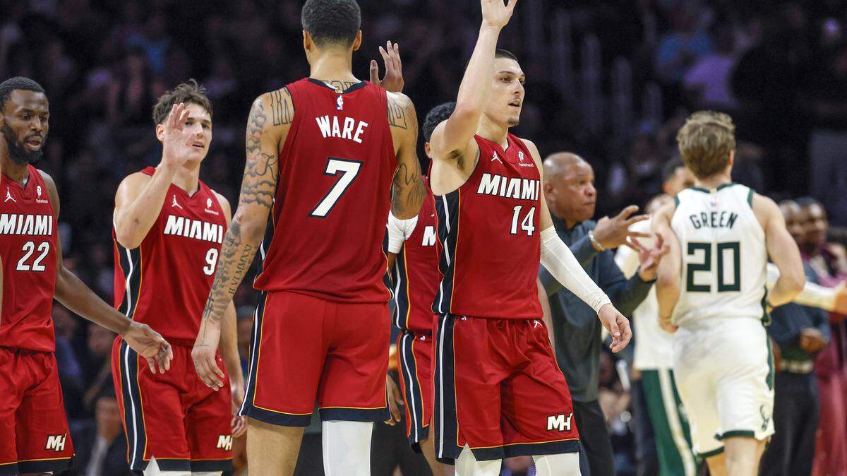 Miami Heat guard Tyler Herro (14) and teammates react as the Heat lead in the second half of their NBA basketball game against the Milwaukee Bucks at Kaseya Center at Miami, FL, on Wednesday, November 26, 2025.