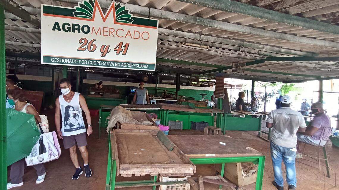 Cubans try to buy food in an almost empty agricultural market in Havana in 2020. The supply system in the country remains troubled with an emerging group of private businesses fighting against price caps and excessive taxes imposed by the communist government.