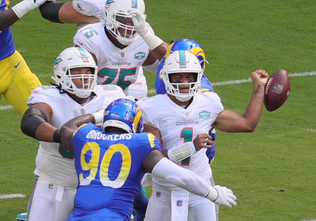 Miami Dolphins quarterback Tua Tagovailoa (1) fumbles under pressure by the Los Angeles Rams defense on his first possession in the first quarter at Hard Rock Stadium in Miami Gardens on Sunday, November 1, 2020.