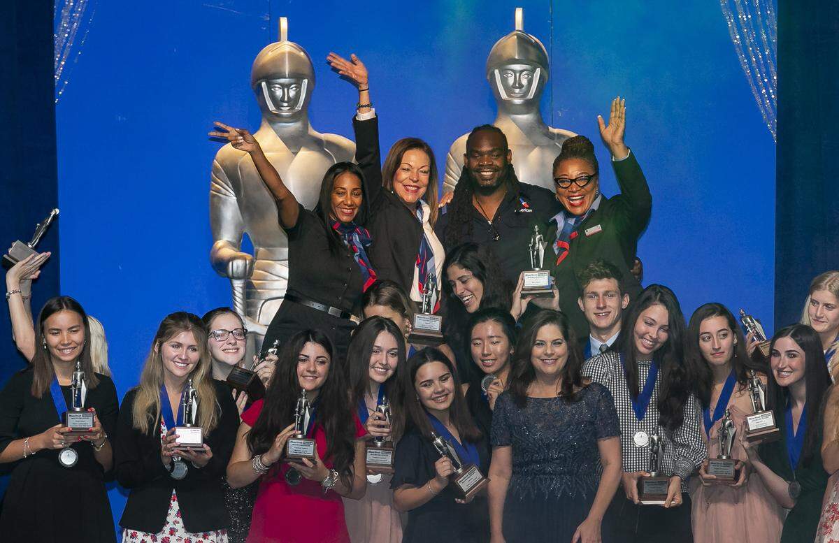 Silver Knight Award winners celebrate on stage with Aminda Marqués González, president and publisher and executive editor of the Miami Herald Media Company, center-right, after the Miami Herald & el Nuevo Herald 61st Silver Knight Awards at the James L. Knight Center on Thursday, May 16, 2019.