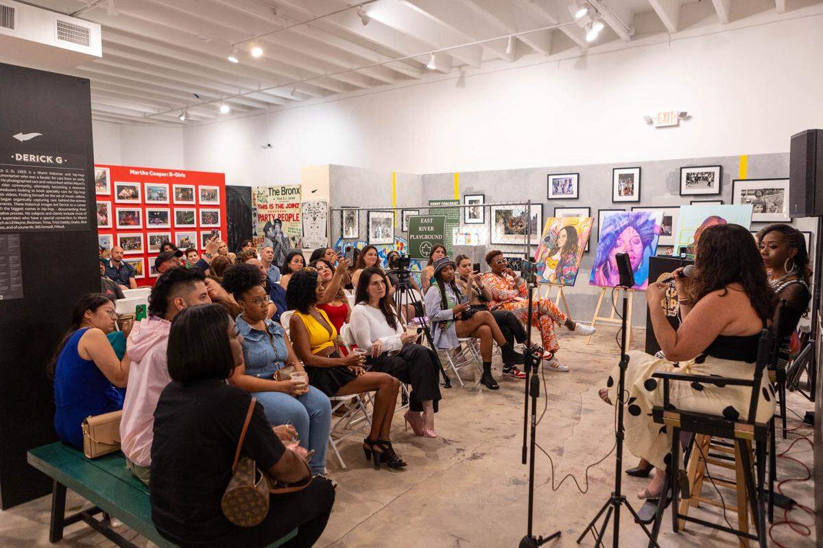 A crowd listens to a panel of female Miami radio legends Supa Cindy, Stichiz and Lucy Lopez at The Art of Hip Hop in Wynwood in celebration of Women’s History Month.