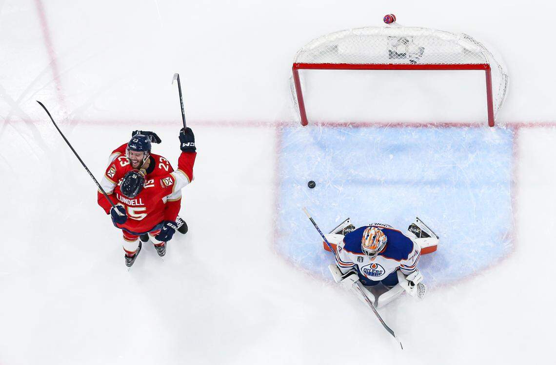 Florida Panthers centers Carter Verhaeghe (23) celebrates with Anton Lundell (15) after scoring a goal against Edmonton Oilers goaltender Stuart Skinner (74) in the first period of Game 7 of the Stanley Cup Final at Amerant Bank Arena on Monday, June 24, 2024, in Sunrise, Fla.