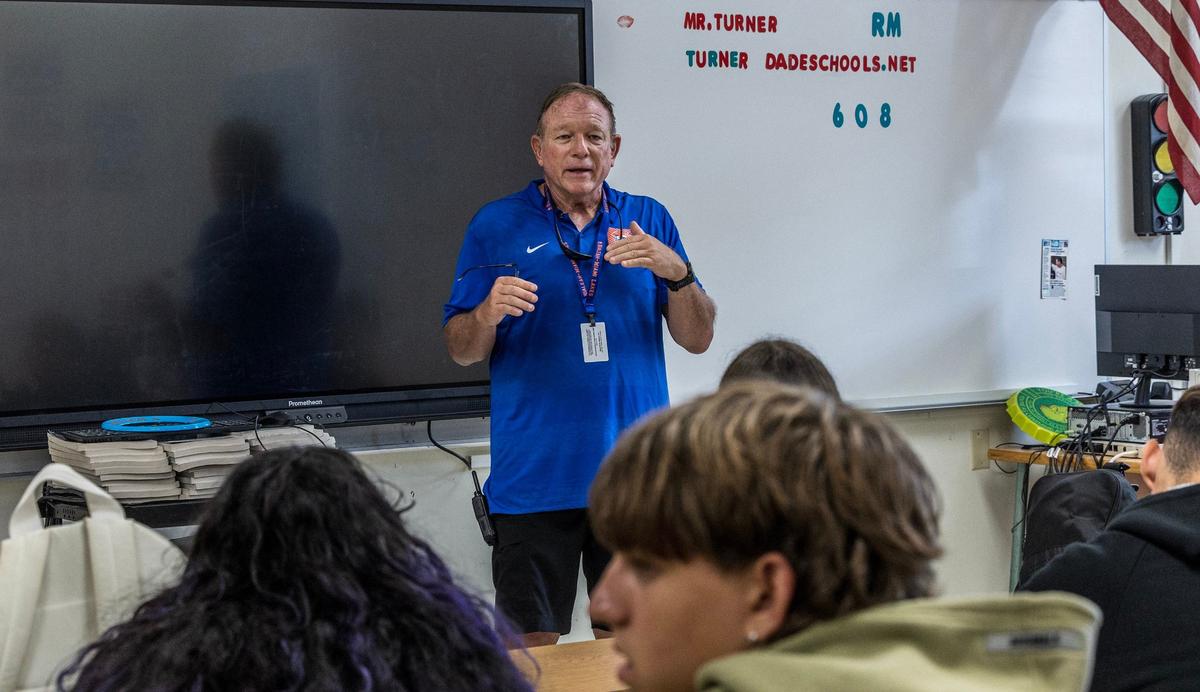 Driver’s education teacher Michael Turner instructs students during a class.