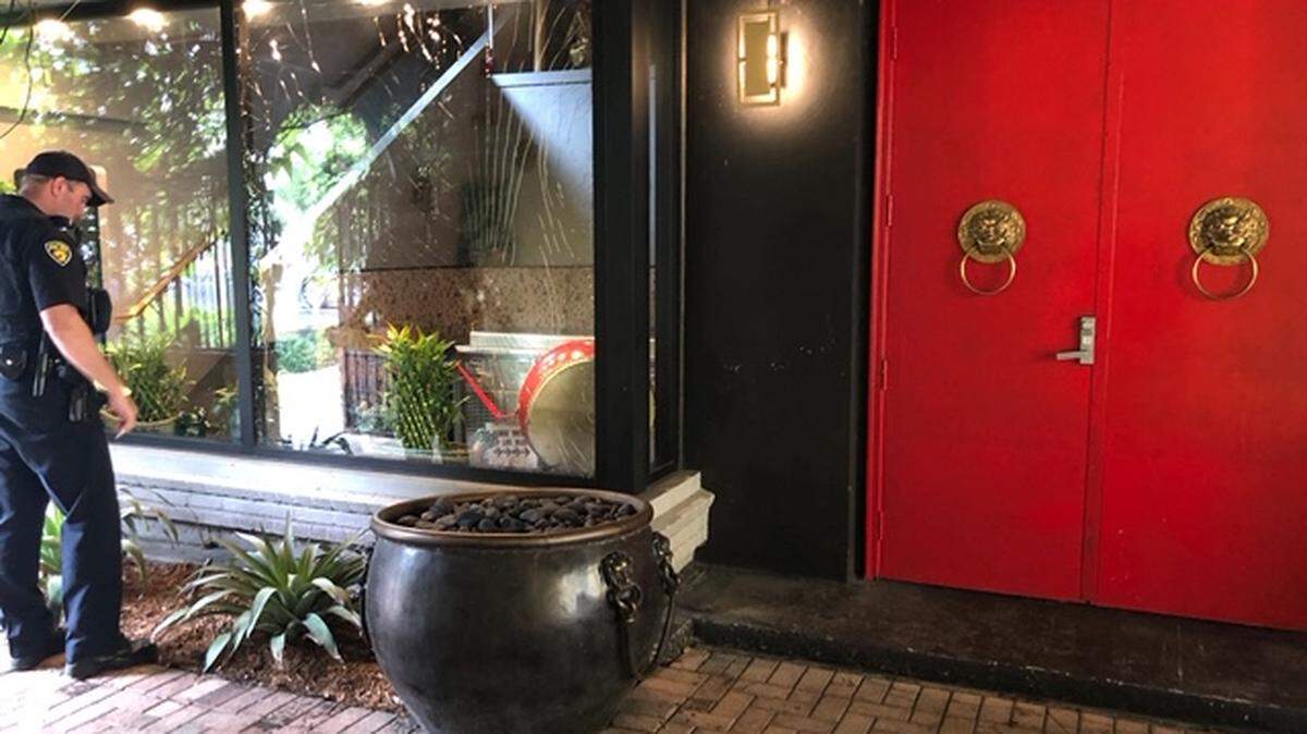 A Fort Lauderdale police officer stands outside Red Door Asian Bistro after an apparent act of vandalism overnight on Nov. 3. The restaurant’s owners are suing a city inspector who they say was motivated by anti-Asian racism to try to block their permits last year.