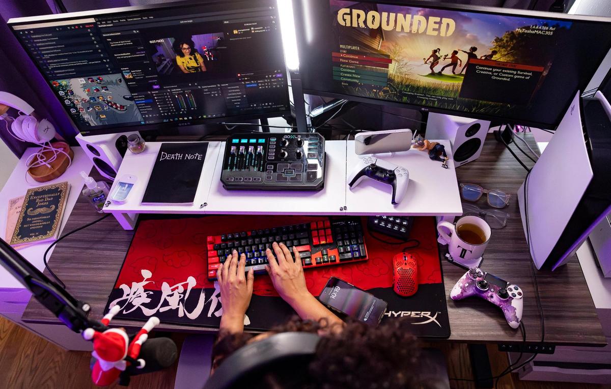 Natasha Walsh, a Twitch streamer and social media influencer, prepares to play the video game “Grounded” at her home on Thursday, April 3, 2025, in Miami. Walsh, whose Twitch handle is BarefootTasha, streams for about five to six hours a day, five times a week, and has almost 40,000 followers on Twitch.