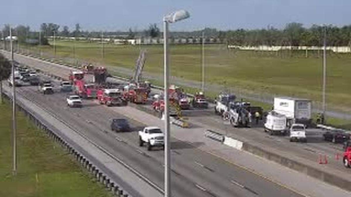 Palm Beach County Fire Rescue helps deal with the Tuesday morning crash on the Florida Turnpike.