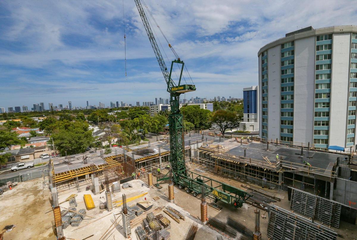 New construction is seen under the shadow of Tower C of the affordable housing community Three Round Towers in the Allapattah section of Miami.