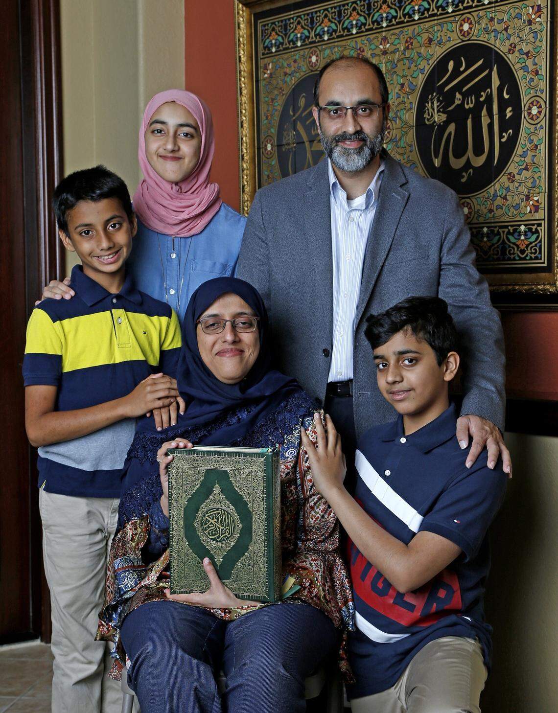 Dr Aisha Subhani, an emergency room physician, poses with her family, son Ali Naqui, left, daughter Asiya Naqui, husband Rehan Naqui and youngest son, Yusuf Naqui, right, at their home in Davie on Friday, May 3, 2019. The family will be celebrating Ramadan together.