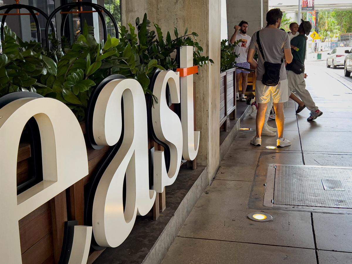 People arrive at the East Hotel on Monday, Sept. 4, 2023, in Brickell City Centre.