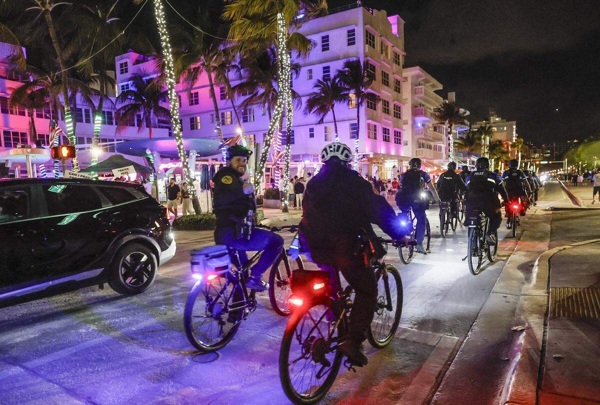 Police officers patrol Ocean Drive as they ride by the Clevelander South Beach Hotel during spring break on Miami Beach Florida on Friday, March 20, 2026.